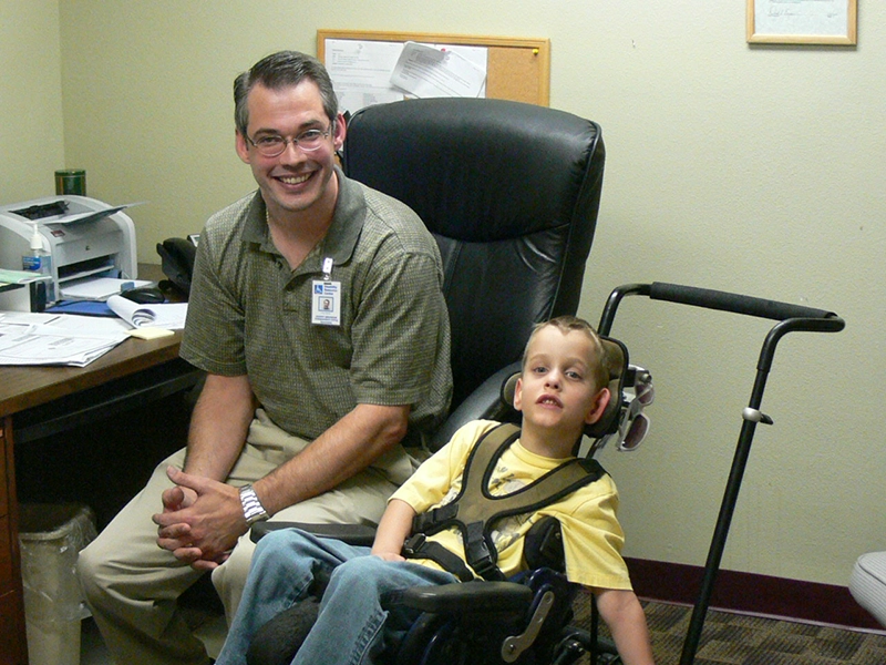 Marshall Hardy and Danny. Marshall is a young boy in a chair with a harness