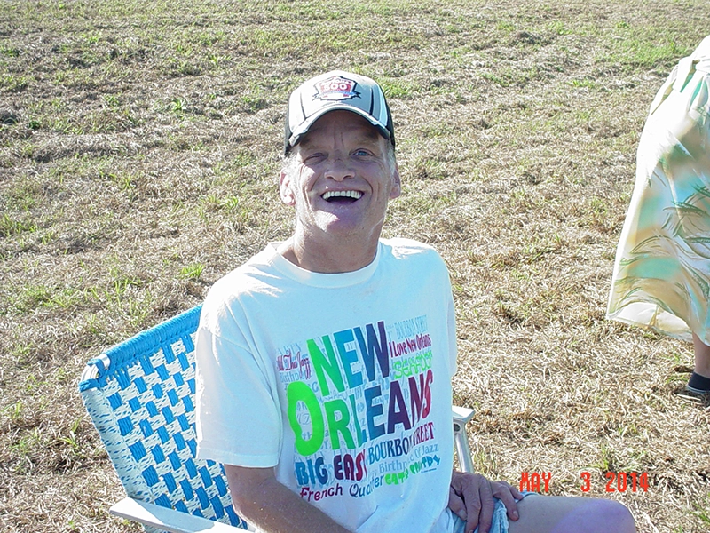 participant o Penwheels Fishing Rodeo smiling in a lawnchair