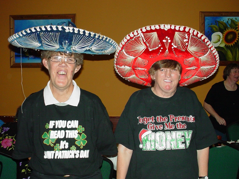 Two women in sombrero hats after a CILNWF meeting