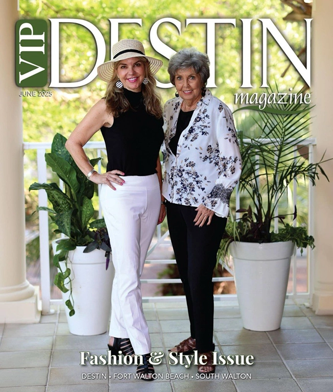 VIP Destin June 2025 Magazine with two ladies standing posing on an outdoor patio